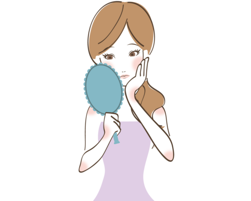 鏡を見る女性